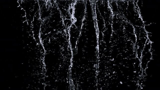 Super Slow Motion Shot of Falling Water Isolated on Black at 1000fps.