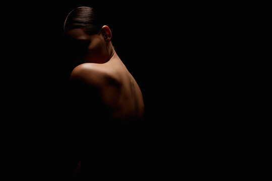 Nude Woman silhouette. Back of Beautiful Naked Body Girl