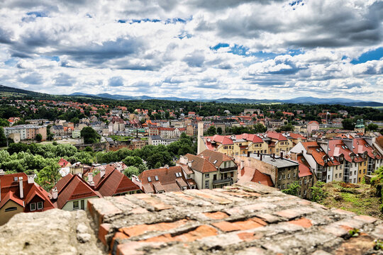 Panoramic European Town Rooftops Under Dramatic Cloudy Sky; klodzko, poland, lower silesia, dolny slask,