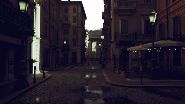 lantern lit narrow lane at evening, warm pools of light on cobbles, empty cafe corners and intimate shadows, romantic vintage atmosphere with slow urban