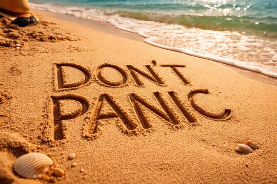 Motivational Dont Panic words carved deep in beach sand