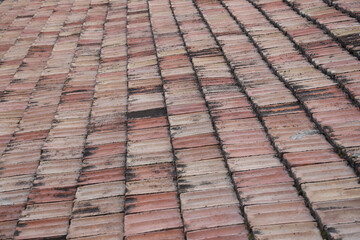 Fototapeta premium brown tiled house home roof tile background backdrop texture pattern texture of seamless vintage retro aged historical red clay ceramic roof tiles