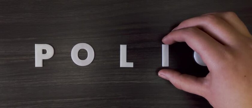 the word polio written on a dark background with white block letters or capital letters (fast version)
 