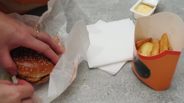 Fast food delivery menu background with various burgers, cheeseburger, nuggets, french fries, fizzy soda drinks. Junk unhealthy fast food, Ultra processed food with low nutrition, high calories value