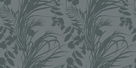 Fototapeta premium Seamless monochrome pattern with graceful branches of tropical leaves with silhouettes for textiles on grey. High quality illustration