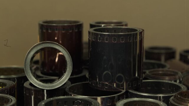 Old photographic films. Old camera film for retro photo shoots. Vintage film rolls for classic photography. Developed retro film rolls from analog cameras