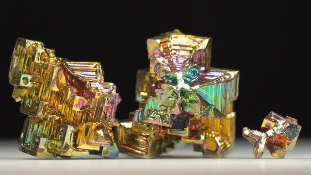 Bismuth crystals. Bismuth - chemical element with symbol Bi and atomic number 83. Post-transition metal and one of pnictogens. Synthesized bismuth crystal. Iridescent coloration is due to oxide film