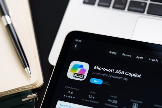 Microsoft 365 Copilot iPad App Store screen showing Apple Liquid Glass redesign and iOS 26 style in workspace closeup. Stafford, United Kingdom, April 13, 2026.