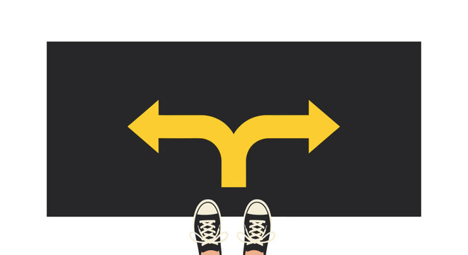 Decision-making concept with shoes facing two diverging directions on road