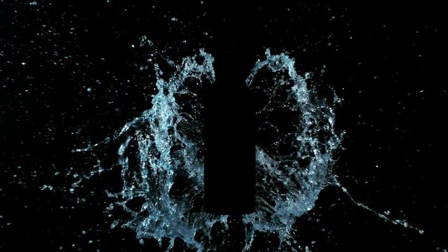 Super Slow Motion of Splashing Water on Black Bottle Shape. Filmed on High Speed Cinema Camera, 1000 fps.