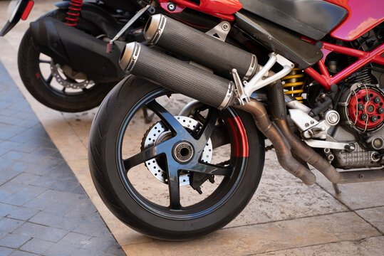 Motorcycle rear wheel and exhaust close up sport bike detail
