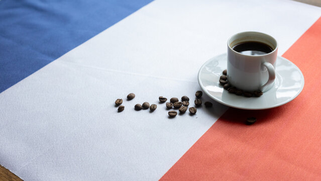 Cup of Coffee with Spoon on French National Flag at Parisian Cafe Close-up