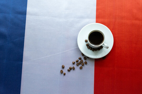 Cup of Coffee with Spoon on French National Flag at Parisian Cafe Close-up