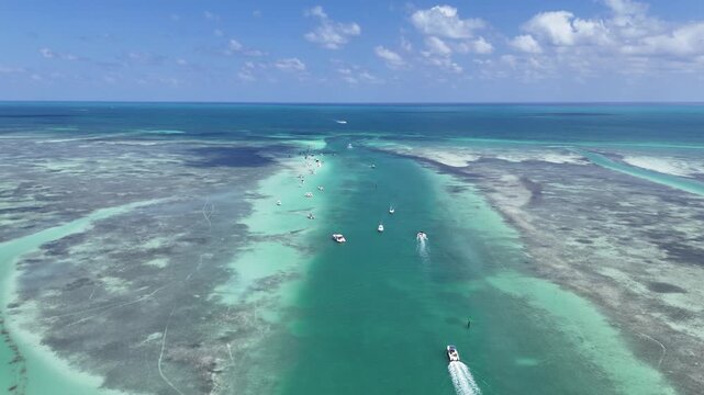 Still shot of boats heading to the popular Islamorada Sandbar through the Whale Harbor Channel at Islamorada in the Florida Keys. 