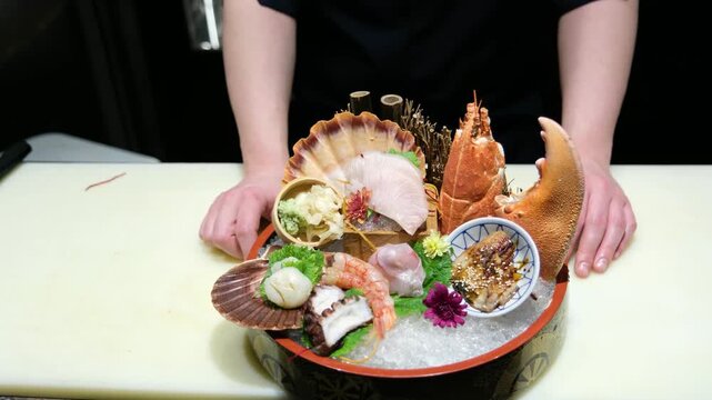 Close up of a masterfully arranged sushi and sashimi platter with garnishes and decorations for a luxury Japanese dining experience and gourmet food photography