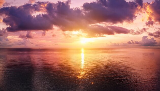 Pink Sunset At Sea Water Reflection Sun Light On Gold Yellow Clouds Sky Nature Background