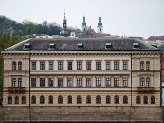 Symmetrical architecture with reflective water. Classical style with balanced windows and stone details © Vladimir