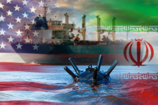 Maritime security, geopolitical tension. Naval mine floats before a cargo ship with US and Iran flag overlays, symbolizing sanctions, risk and sea conflict.