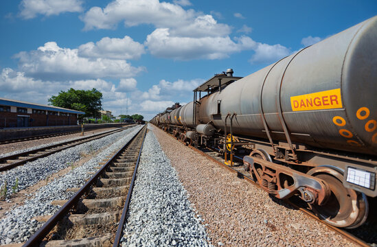 industrial Fuel Tanker Train on Railway Tracks lead wagon with Danger Sign