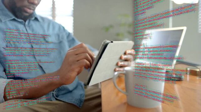 Male developer tapping tablet with stylus activating code overlay grabbing coffee resuming coding
