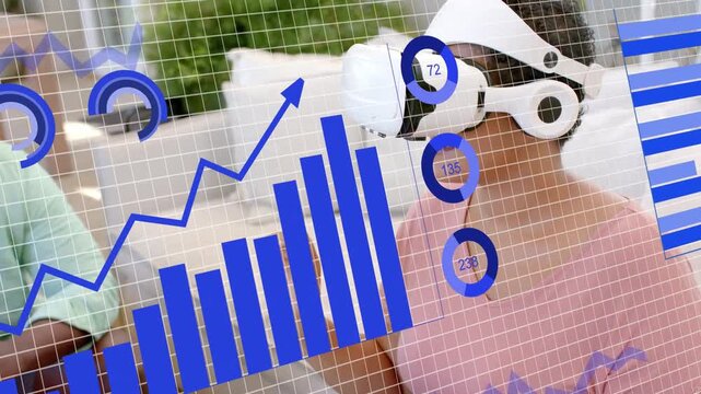 Woman putting VR headset on couch, overlay appearing with charts, pointing and analyzing tech data