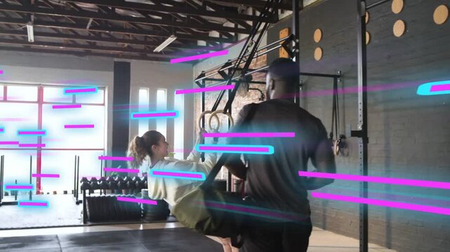 Man entering gym with green duffel bag, woman doing ring rows, animated overlay counting reps