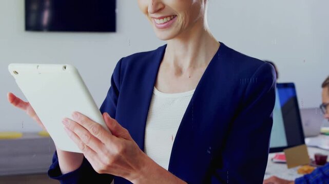 Woman holding white tablet, tapping and causing animated charts over tablet for business review