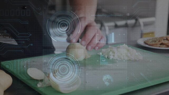 Cook placing halved onion, dicing finely on green cutting board while HUD guiding kitchen prep