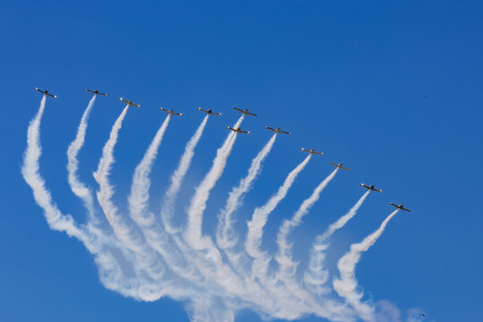 Full Throttle Formation Team in Spirit Formation 
12 Vans Rvs over show center at Sun n Fun