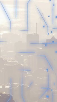 Vertical video: Hazy skyline showing blue circuit grids on play, pulsing, fading, mapping city data