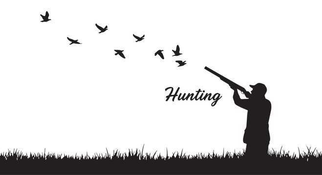 Silhouette of a man hunting birds with a shotgun in a field