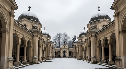 Fototapeta premium Snow covered cemetery architecture with arches and dome structures