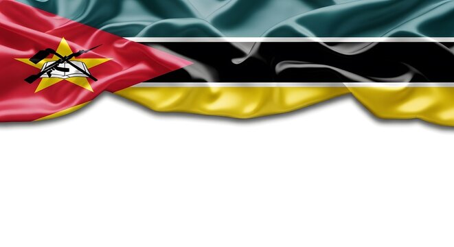 Wavy flag of Mozambique with its distinctive emblem featuring an AK-47, hoe, and open book, against a white background.