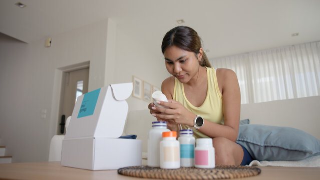 Young asia people woman buy custom tailor made anti aging pill bottle diet immune plan online health care shop open gift box weight loss herbal. Unbox order store clinic home service life balance.