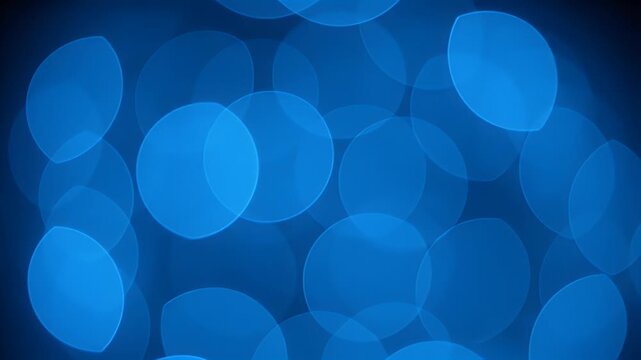 A vibrant blue background features a scattering of soft, circular bokeh lights, creating a dreamy and abstract visual effect.