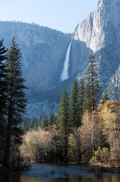 View of Yosemite Falls with the Merced river in the foreground