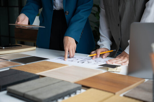 Interior Designer Consulting with Client on Material Selection
