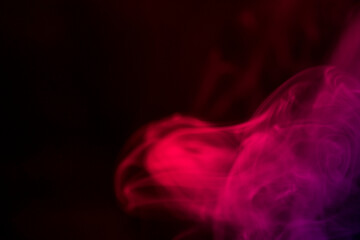 Obraz premium Colorful Smoke Swirls in Artistic Background of Red and Purple Hues