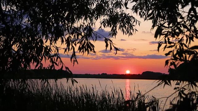 Beautiful sunset on the lake in Ukraine during summer