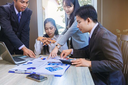 Business peoples meeting to discuss the situation on business plan, marketing for investment. Selected focus