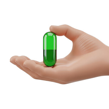 Hand holding a green pill capsule
