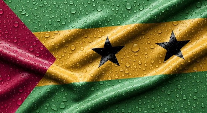 Close-up view of the national flag of S&atilde;o Tom&eacute; and Pr&iacute;ncipe covered in glistening water droplets.