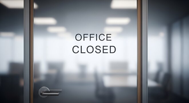 Office closed sign on glass door of a modern corporate workspace during business downtime.