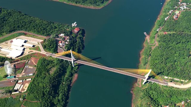 Aerial drone view of the Triple Frontier where Brazil, Argentina and Paraguay meet at the Parana River with the integration bridge.