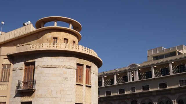 Elegant Art Deco architecture of a historic building in downtown Beirut. Traditional stone facade with rounded balconies showcasing Lebanon's early 20th-century colonial heritage 