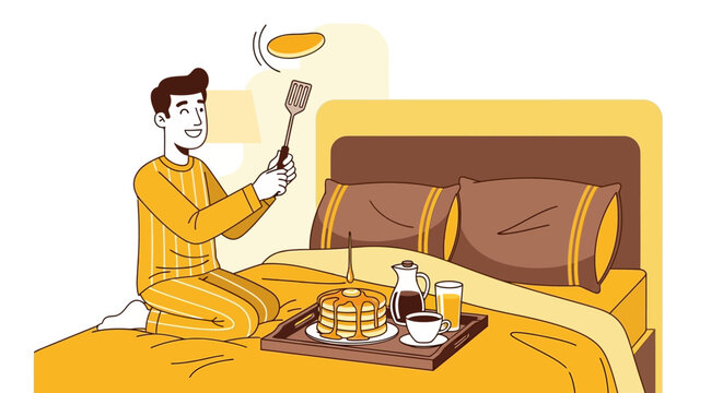 A man wearing pajamas preparing a pancake breakfast in bed.