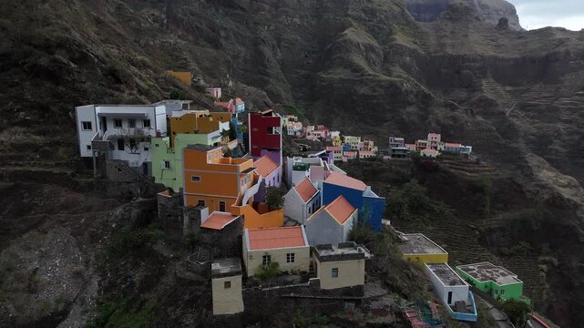 Close-up drone shot of the colorful houses in Fontainhas village, Santo Antao. Aerial view of the famous mountain hamlet perched on a steep ridge over deep valleys in Cape Verde