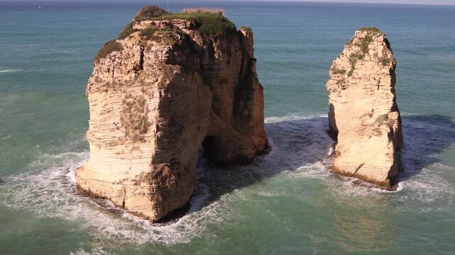 Close-up of the Raouche Rocks limestone formations in Beirut. The iconic natural landmark of Lebanon standing in the Mediterranean Sea, showcasing geological beauty and coastal scenery 