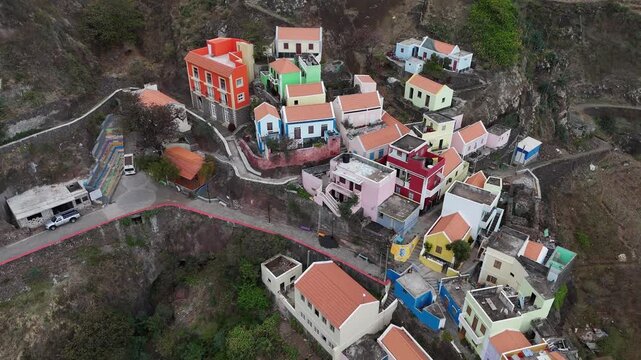 Close-up aerial drone view of the vibrant architecture in Fontainhas, Santo Antao. Bird's-eye perspective of the mountain village's colorful houses on the volcanic slopes of Cape Verde