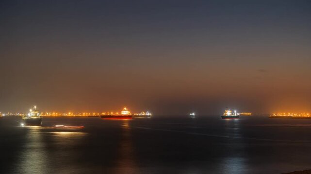 Cargo Ships and Oil Tankers in the Strait of Hormuz at Sunset